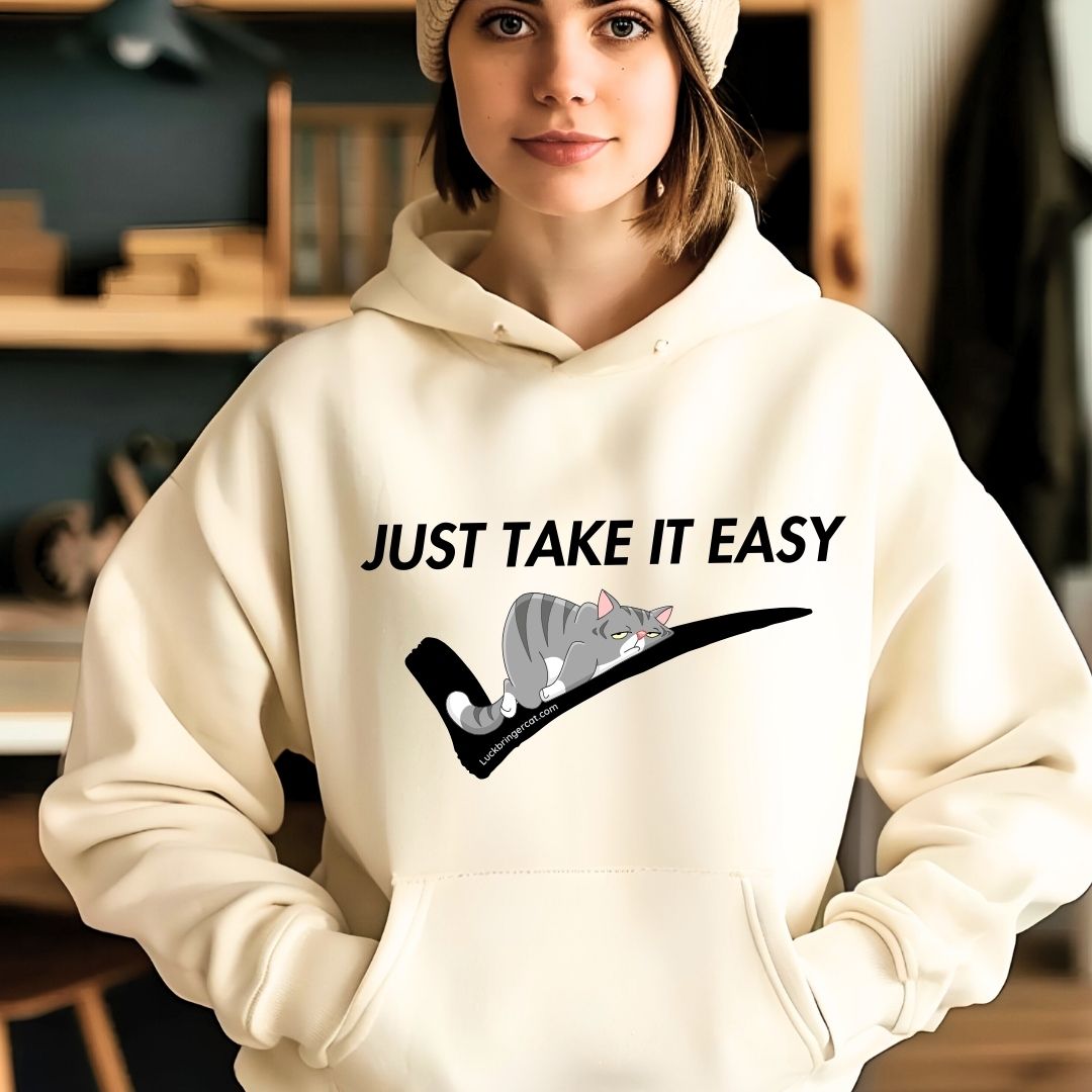 Funny Hoodie- In today's busy world, just taking it easy is as important as just doing it! 😉 Wear our funny 'Just Take It Easy' hoodie as a reminder to unwind and recharge when needed. 💪🏻😊👕🌟 These shirts also make perfect gifts for cat lovers, cat moms, cat dads and cat enthusiasts. 🐈🎁