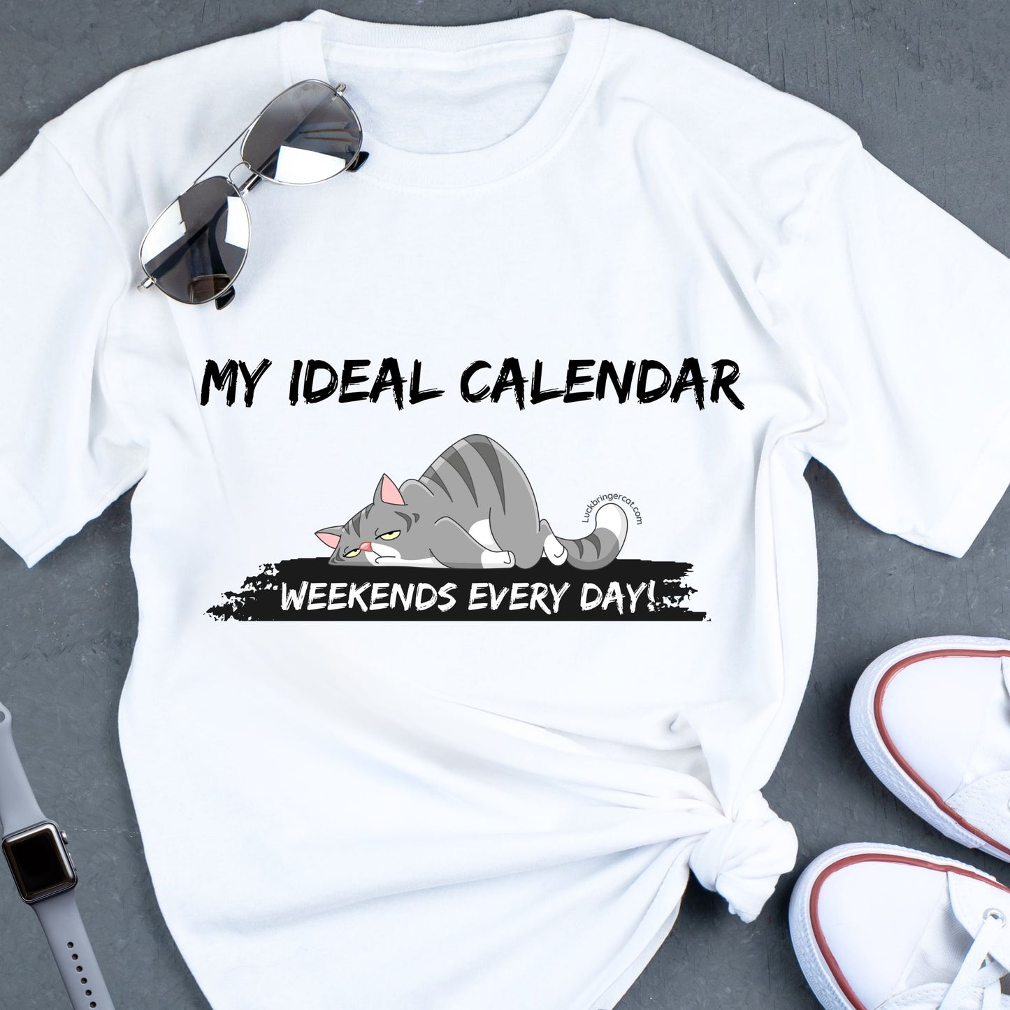 Funny Cat Dad Cat Mom Shirt- Unisex-This tee is not only perfect for cat lovers but also for everyone who craves the freedom to live life on their own terms. Ideal Christmas or Birthday gift for everyone. text on the shirt: my ideal calendar, weekends every day; with a sleepy cat graphic